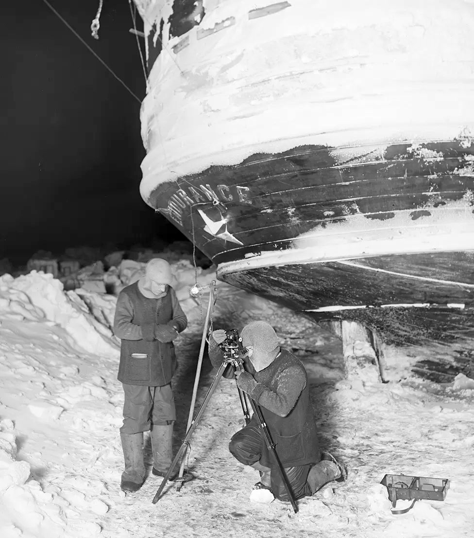 Frank Worsley and Ernest Shackleton, surveying the Antarctic ice