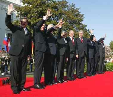 U.S. President, NATO Secretary General, and the Prime Ministers of Latvia, Slovenia, Lithuania, Slovakia, Romania, Bulgaria, and Estonia after a South Lawn ceremony welcoming them into NATO on 29 March 2004